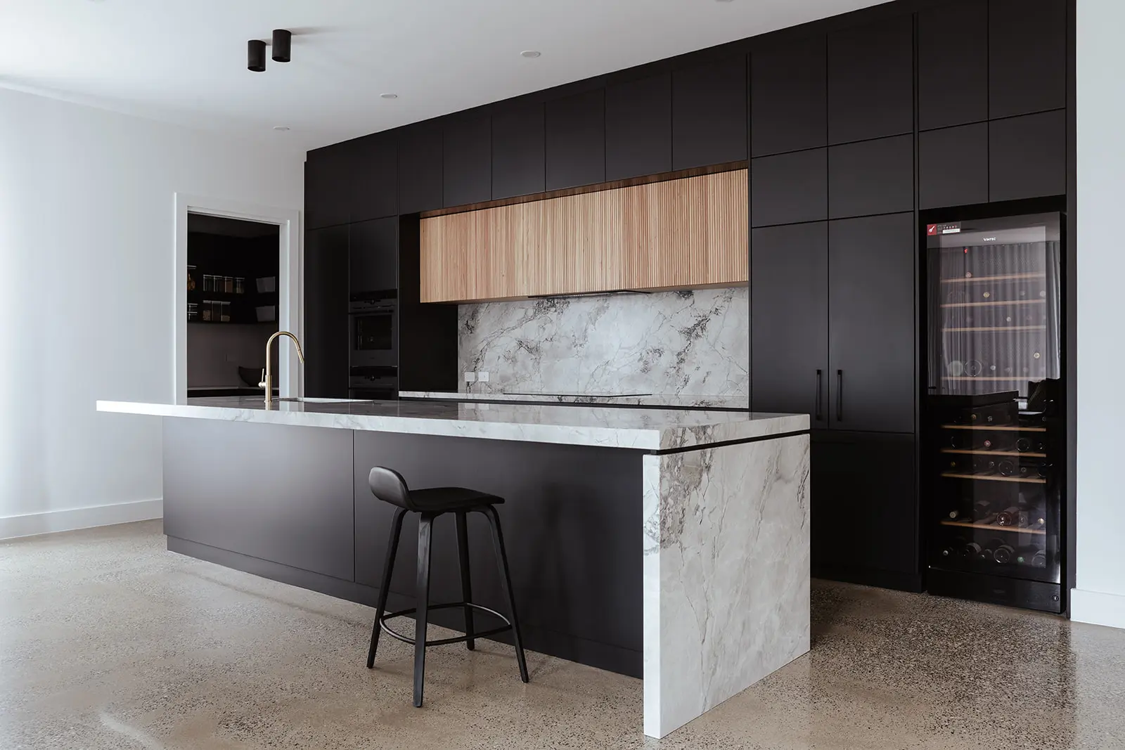 Finished marble kitchen with island bench inside residential Magill project